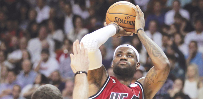 Portland Trail Blazersu2019 Aleksandar Pavlovic (L) defends as Miami Heatu2019s LeBron James shoots during their NBA game in Miami. (Reuters)