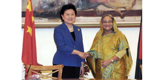 Chinese Vice Premier Liu Yandong, left, shakes hands with Bangladeshi Prime Minister Sheikh Hasina in Dhaka yesterday. 
