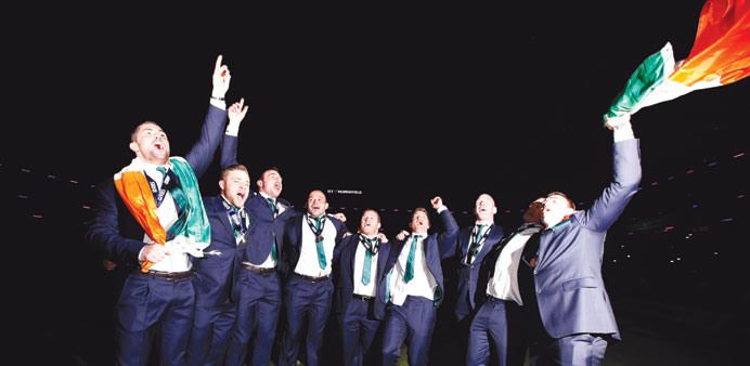 Ireland players celebrate after winning the Six Nations championship at Murrayfield in Edinburgh on Saturday. (AFP)
