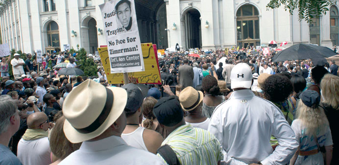 People listen during a rally in memory of Trayvon Martin at a rally yesterday in New York. Civil rights groups mobilised for protests in cities across