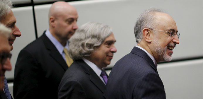 The head of the Iranian Atomic Energy Organization Ali Akbar Salehi and U.S. Secretary of Energy Ernest Moniz (3rd R) leave