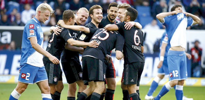 Bayern Munich players celebrate their win over Hoffenheim in their Bundesliga match in Sinsheim yesterday. Bayern won 2-0. (Reuters)