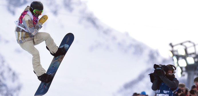 Shaun White competes in the Menu2019s Snowboard Halfpipe qualifications at the Rosa Khutor Extreme Park during the Sochi Winter Olympics yesterday.  (AFP)