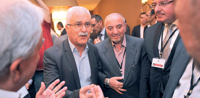 Syrian National Council president George Sabra talks with other opposition members during a break at the meeting in Istanbul yesterday.