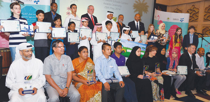 Winners of the Qatar e-Nature contest  with officials at the awarding ceremony. PICTURE: Noushad Thekkayil.