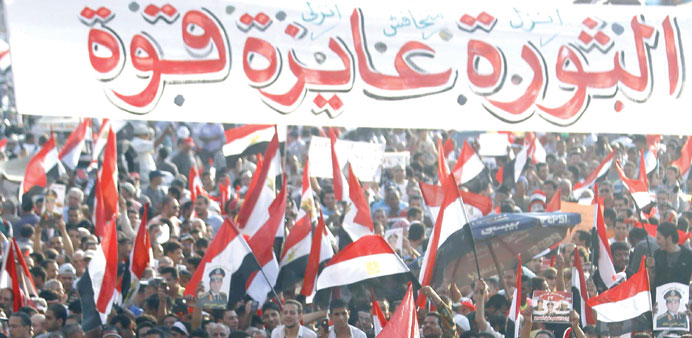 Anti-Mursi protesters demonstrate at Tahrir Square in Cairo yesterday.