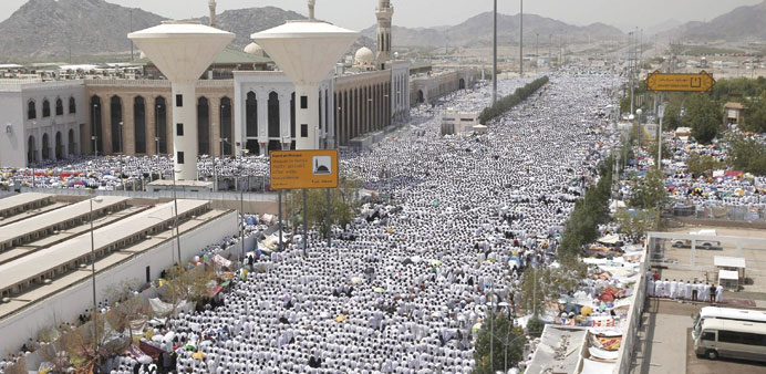 Pilgrims perform prayers in Arafat during the annual Haj pilgrimage, outside the holy city of Makkah on Wednesday.