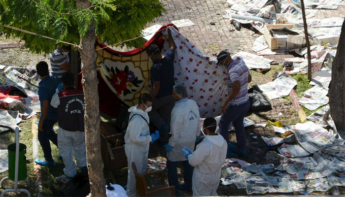 Police forensic experts examine after an explosion in Suruc in the southeastern Sanliurfa province, Turkey. Reuters