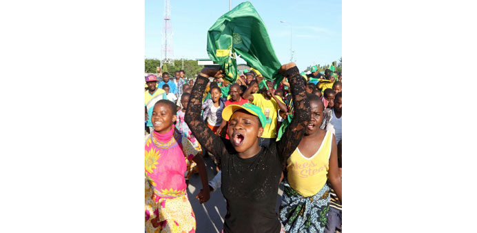 Supporters of Tanzania presidential candidate John Pombe Magufuli celebrate after he was declared the winner in Dar es Salaam yesterday.