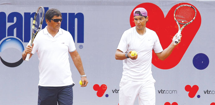 Spanish player Rafael Nadal with his uncle and coach Toni during a training session at country club Las Salinas in Vina del Mar City. (Reuters)