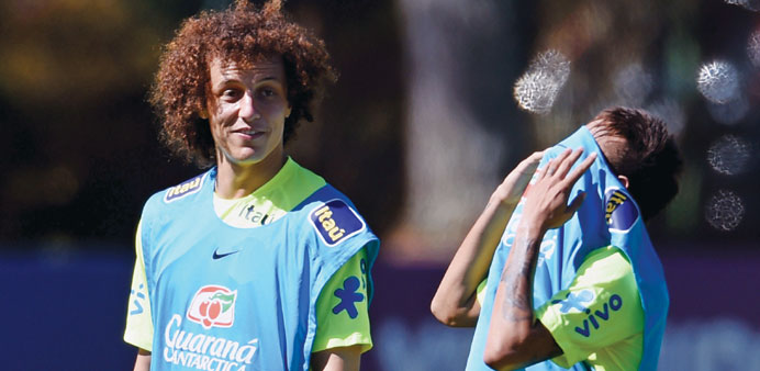 Brazilu2019s David Luiz jokes with team-mate Neymar during training.