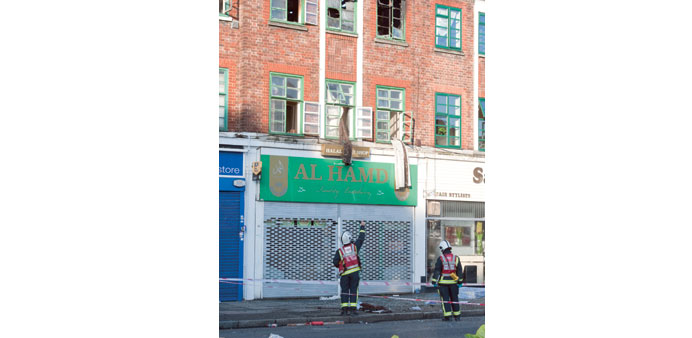 Firemen at the scene of the blaze in in Hounslow