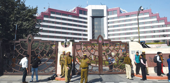 Police stand guard outside the Delhi Secretariat yesterday during a raid by the CBI.