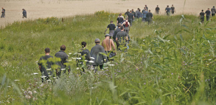Ukrainian coal miners searching the crash site of Malaysia Airlines Flight MH17, near the village of Hrabove, Donetsk region.