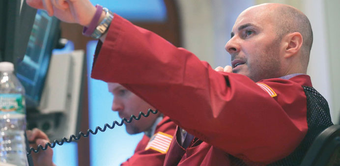 Traders work on the floor of the New York Stock Exchange yesterday. US stocks gained in early trade yesterday after two days of losses.