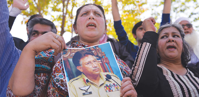 Pakistani supporters of former military ruler Pervez Musharraf shout slogans outside a special court set up to try Musharraf during a hearing in Islam
