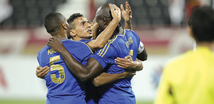 Al Sailiyau2019s Abdulrahman al-Hurazzi (centre) celebrates after scoring the equaliser against El Jaish during their QSL match yesterday. 