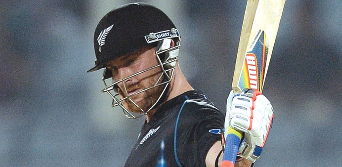 New Zealand batsman Brendon McCullum raises his bat after his half century yesterday against the Netherlands. (AFP)