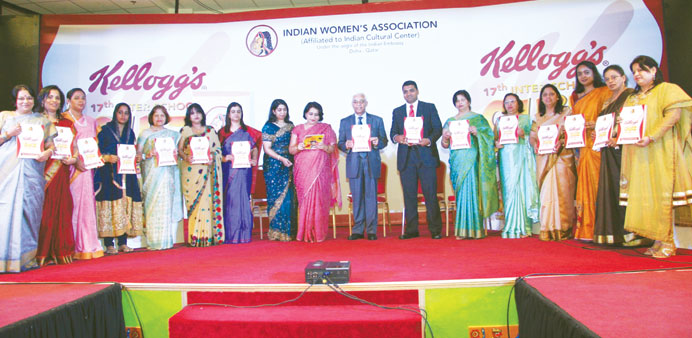 Indian ambassador Sanjiv Arora releasing the IWA souvenir at the function.