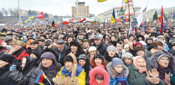 Protesters shout slogans during a rally of the pro-Western Ukrainian opposition on Independence Square in Kiev yesterday