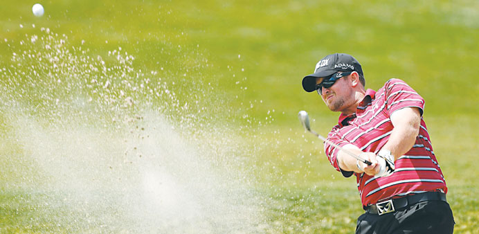Steve Wheatcroft plays a bunker shot on the eighth hole during the second round of the Shell Houston Open at the Redstone Golf Club in Humble, Texas. 