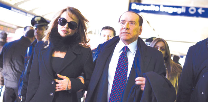 Berlusconi with Pascale: she has been quoted as saying that she has had to keep tabs on his spending.
