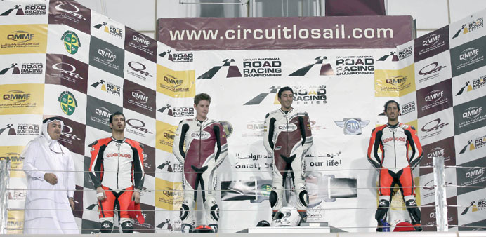 Nasser al-Malki, Alex Cudlin and Mishal al-Naimi on the QIRRCH podium at the Losail International Circuit.