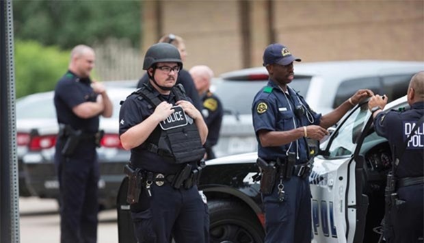 Police patrol the scene as Police Headquarters is in lockdown due to a threat in Dallas, Texas on Saturday.