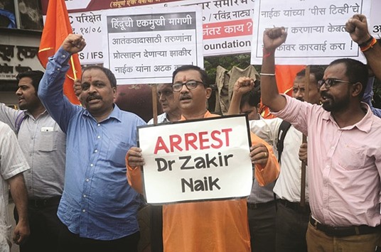 Rightwing activists stage a demonstration against Islamic preacher Zakir Naik in Mumbai. Naik is under the scanner following revelations that two of the five young militants who massacred 22 people at a popular cafe in Dhaka drew their inspiration from his speeches.