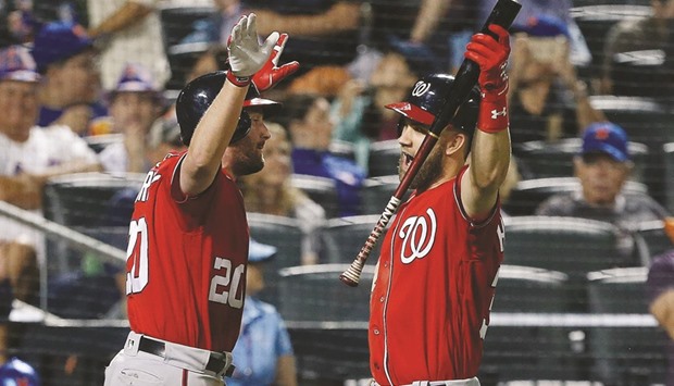 Washington Nationals second baseman Daniel Murphy (L) celebrates with right fielder Bryce Harper after hitting a home run against the New York Mets. PICTURE: USA TODAY Sports