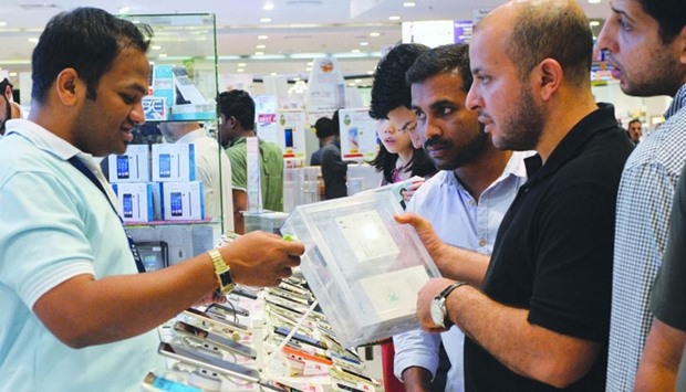 Customers line up for smartphones, which saw an increase in sales during Eid al-Fitr.