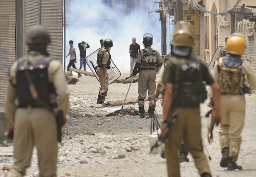 Protesters clash with police in Srinagar yesterday. The death toll from unrest in Kashmir climbed to 21 yesterday despite authorities imposing a harsher curfew in a bid to prevent new demonstrations.