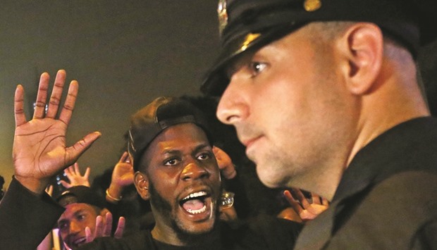 A protester shouts u201cLook at meu201d towards a NYPD police officer during a march against police brutality in Manhattan, New York.