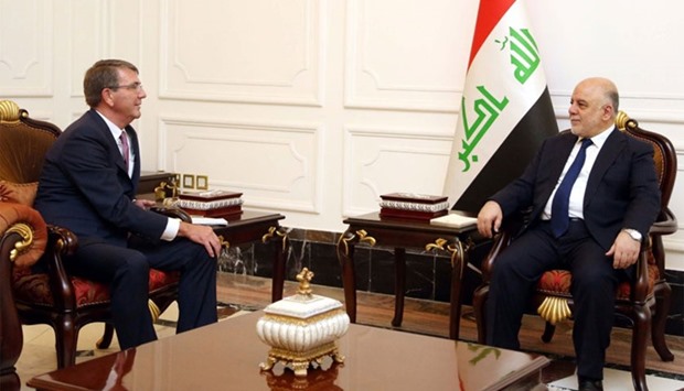 Iraqi Prime Minister Haidar al-Abadi (R) meeting with US Pentagon chief Ashton Carter in Baghdad.