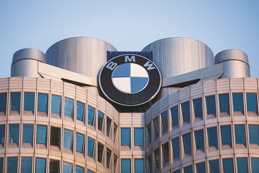 The company logo is displayed on top of BMW headquarters in Munich. BMW is teaming up with Intel and Mobileye to develop new technology for the auto industry that could put self-driving cars on the road by around 2021.