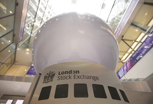 A logo is displayed on an interactive sculpture in the main atrium of the London Stock Exchange headquarters. The FTSE 100 closed up 1.1% to 6,577.83 points yesterday.