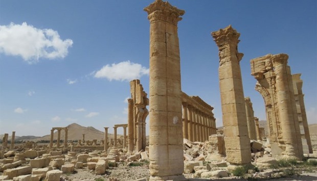 A general view taken on March 27, 2016 shows part of the remains of Arch of Triumph, also called the Monumental Arch of Palmyra, that was destroyed by Islamic State (IS) group jihadists in October 2015 in the ancient Syrian city of Palmyra, after government troops recaptured the UNESCO world heritage site from the Islamic State (IS) group.