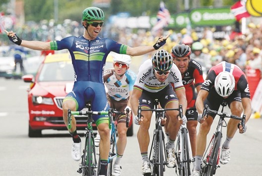 Orica-BikeExchangeu2019s Australian rider Michael Matthews (left) celebrates as he crosses the finish line to win stage 10 of the Tour de France between Escaldes-Engordany, Andorra, and Revel, France, yesterday. (Reuters)