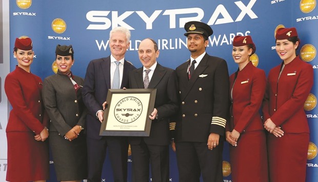 Lord Paul Deighton, chairman of Heathrow Airport, presents Qatar Airways Group chief executive Akbar al-Baker with the u2018Worldu2019s Best Business Classu2019 accolade at the Farnborough International Airshow in the UK yesterday.
