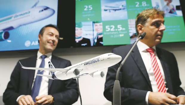 Fabrice Bregier (left), president and CEO of Airbus, and Karsten Balke, CEO of Germania, address a press conference at the Farnborough Airshow, south west of London yesterday. The German airline yesterday ordered 25 single-aisle fuel-efficient Airbus A320neos worth $2.6bn at list prices.