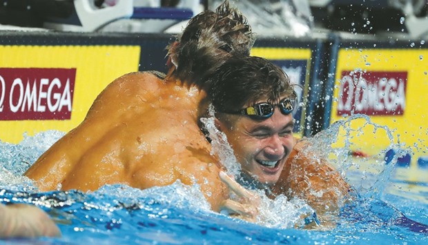 Nathan Adrian (right) of the United States celebrates with Caeleb Dressel after winning the final heat for the menu2019s 100 metre freestyle during the 2016 US Olympic Team Swimming Trials at CenturyLink Center in Omaha, Nebraska on Thursday. (AFP)