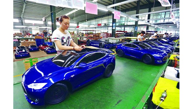 Workers assemble toy cars at a toy factory in Jinjiang, Fujian province. Activity in Chinese factories suffered its sharpest deterioration for four months in June, figures showed yesterday, as weak demand and industrial overcapacity weighed on the worldu2019s second-largest economy.