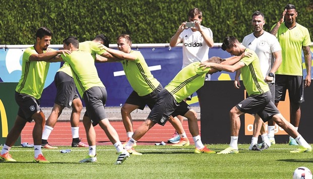 German players warm up during a training session in Evian, France, yesterday, on the eve of their quarter-final against Italy. (AFP)