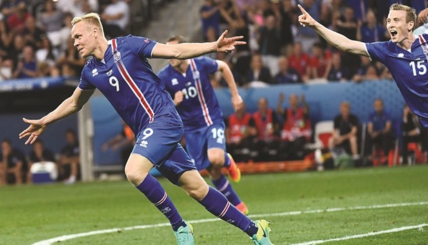 Icelandu2019s Kolbeinn Sigthorsson celebrates after scoring against England during the Euro 2016 Round of 16 match in Nice on Monday. Sigthorsson is an example of Icelandu2019s incubator clubs cultivating talent with top-notch coaching and indoor pitches (AFP)