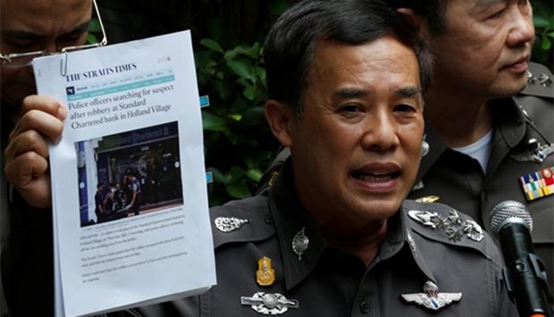 Thailand's deputy national police chief Wuthi Liptapallop speaks during a news conference on the bank robbery in Singapore, at the Immigration Detention Centre in Bangkok on Wednesday.