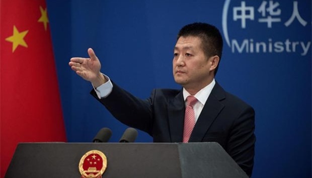 Chinese Foreign Ministry spokesman Lu Kang takes questions from media during a press conference in Beijing on Wednesday.