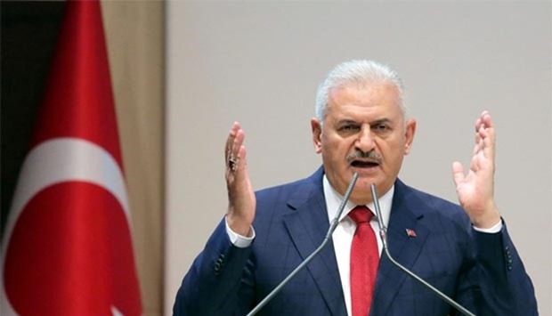 Turkish Prime Minister and leader of the Justice and Development Party (AK Party) Binali Yildirim gestures as he delivers a speech during the AKP's 110th provincial chairpersons' meeting at the AKP headquarters in Ankara on Wednesday.