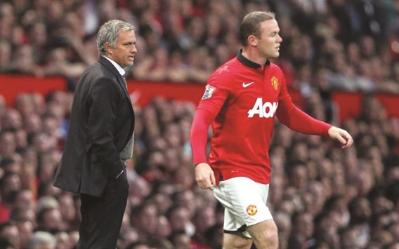 Wayne Rooney (R) and Jose Mourinho.