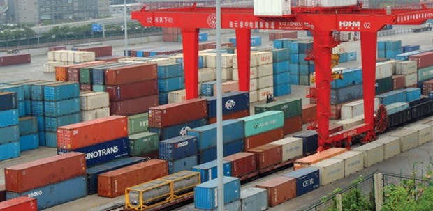 Cargo containers wait to be transported at a port in Lianyungang, Jiangsu province. Chinau2019s imports fell 2.3% year-on-year in yuan terms in June, official data showed.
