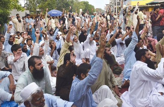 Pakistani supporters of the banned organisation Jamaat-ud-Dawa (JuD) gather in protest against the killings in India-administered Kashmir, in Lahore.